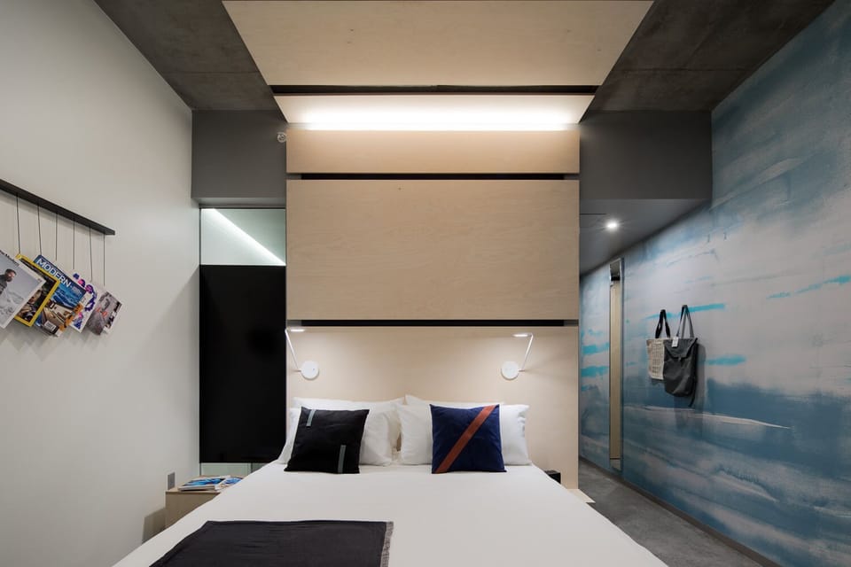 Recharge in minimalist comfort with soft textures and quiet ambience.