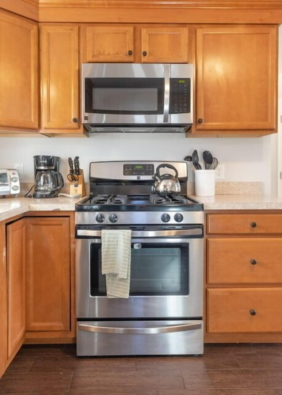 Beautiful gas stove with full pot coffee maker.