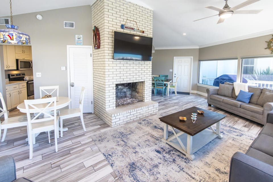 Spacious living room with cozy fireplace and natural light
