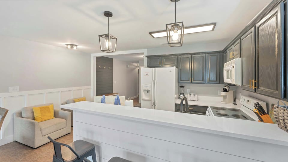 Enjoy casual dining at the kitchen bar, ideal for morning coffee or evening conversation while dinner is prepared.