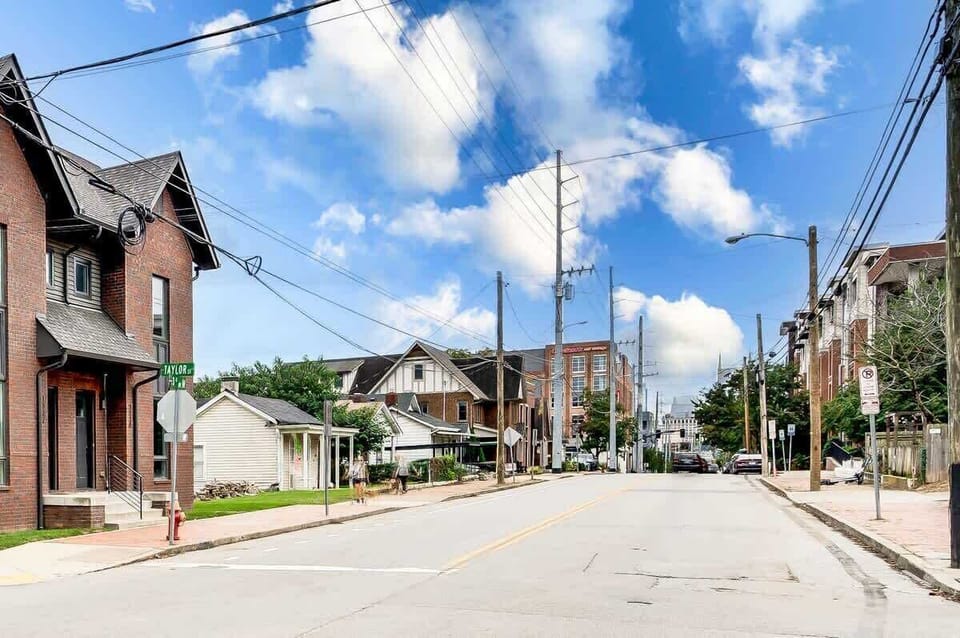The exterior of this beautiful townhome features a charming blend of traditional design and modern accents, offering a welcoming atmosphere from the moment you arrive.

