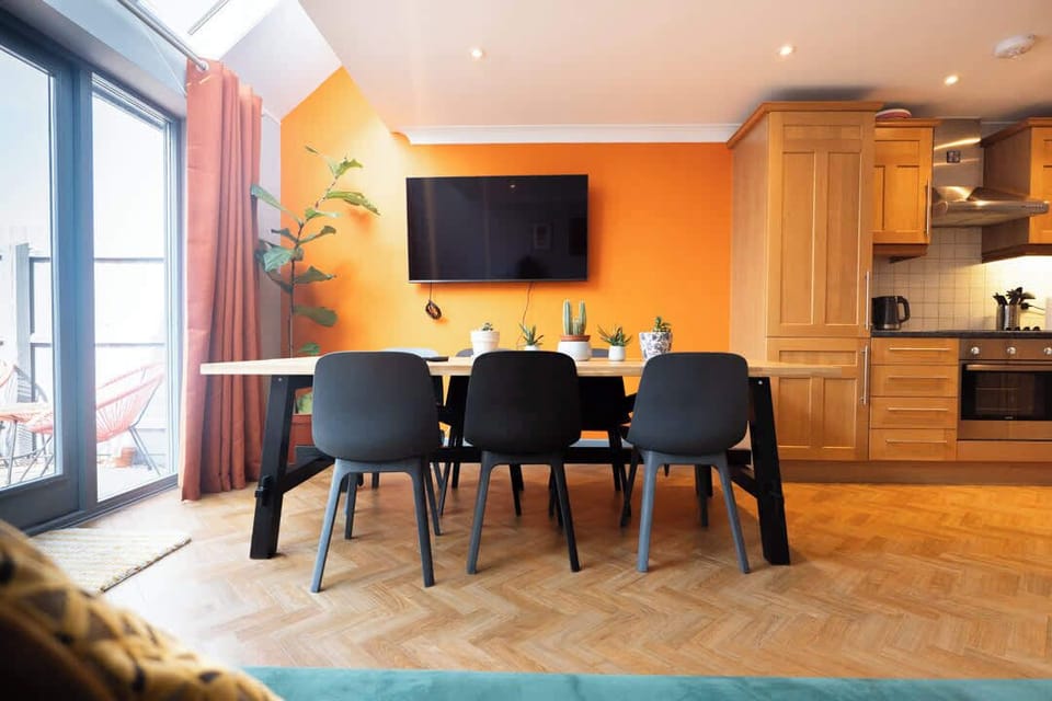 Where dining meets relaxation—enjoy meals and movie nights in this perfect blend of comfort and style.
