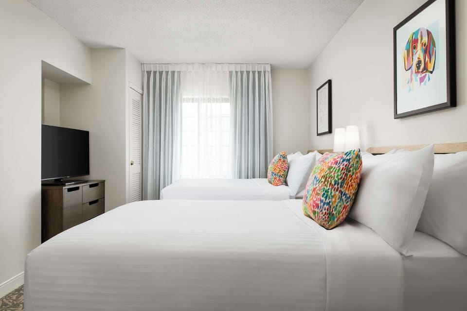 Unwind in bright twin beds with TV for easy nights.