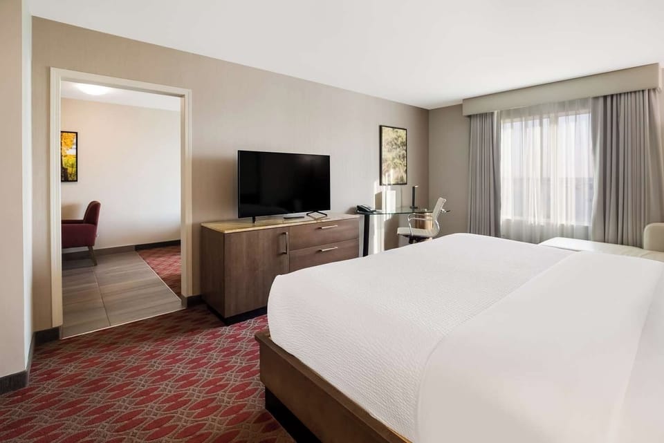 Stretch out on crisp linens in a calm, modern space.