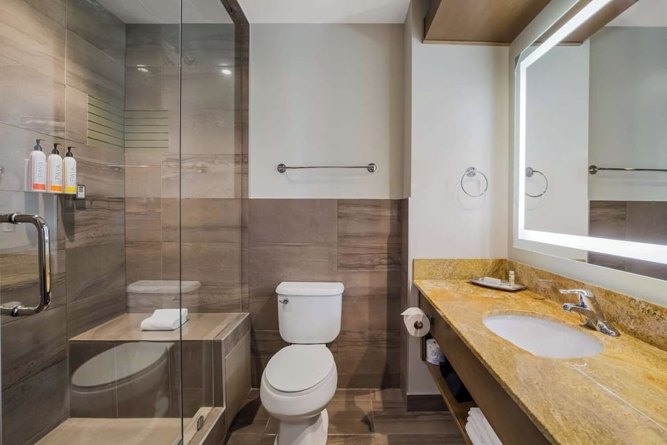 Start your day at a gleaming vanity with bright mirror.