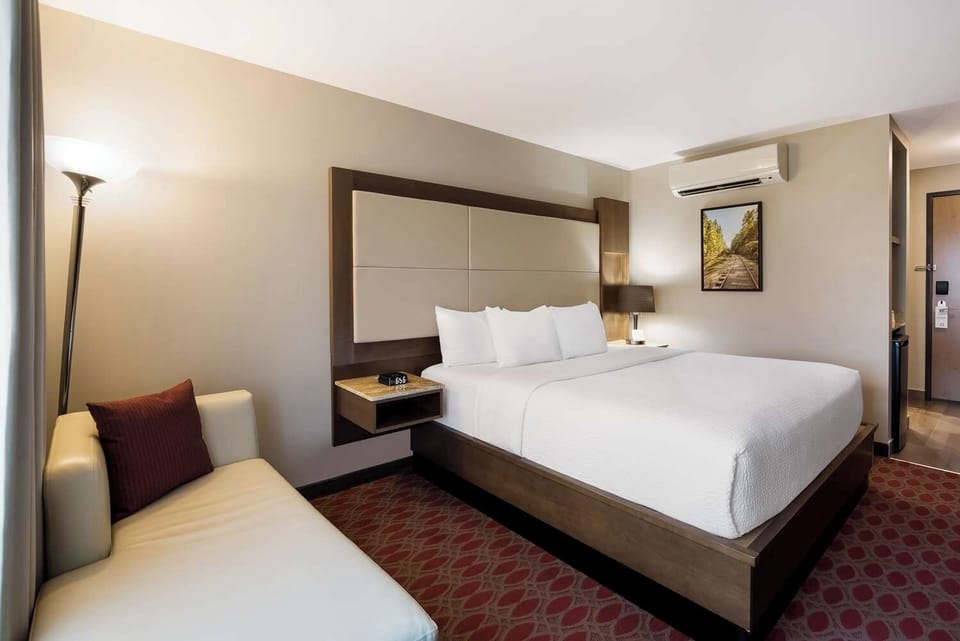Sink into crisp linens after a long day exploring.