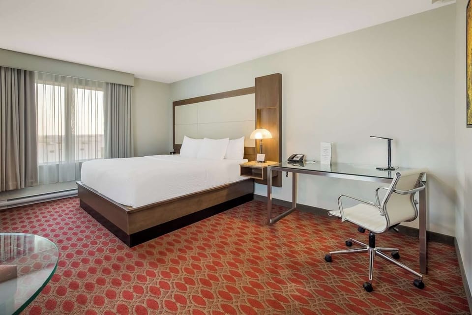 Unwind in a bright, spacious room with sleek workspace.