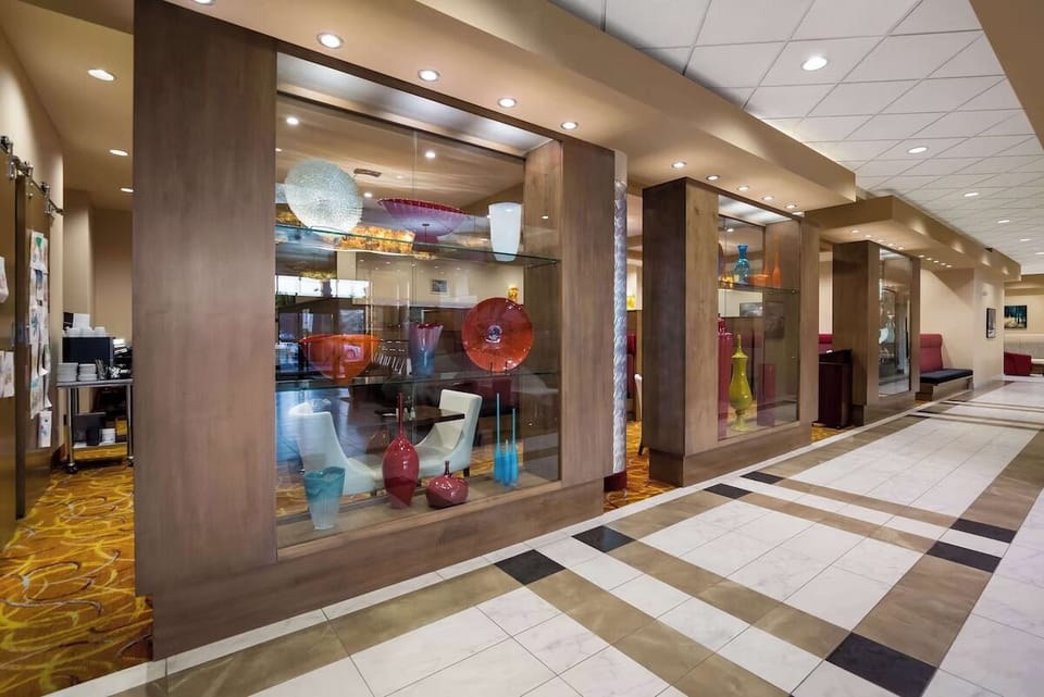 Wander through stylish lobby displays under bright, modern lighting.