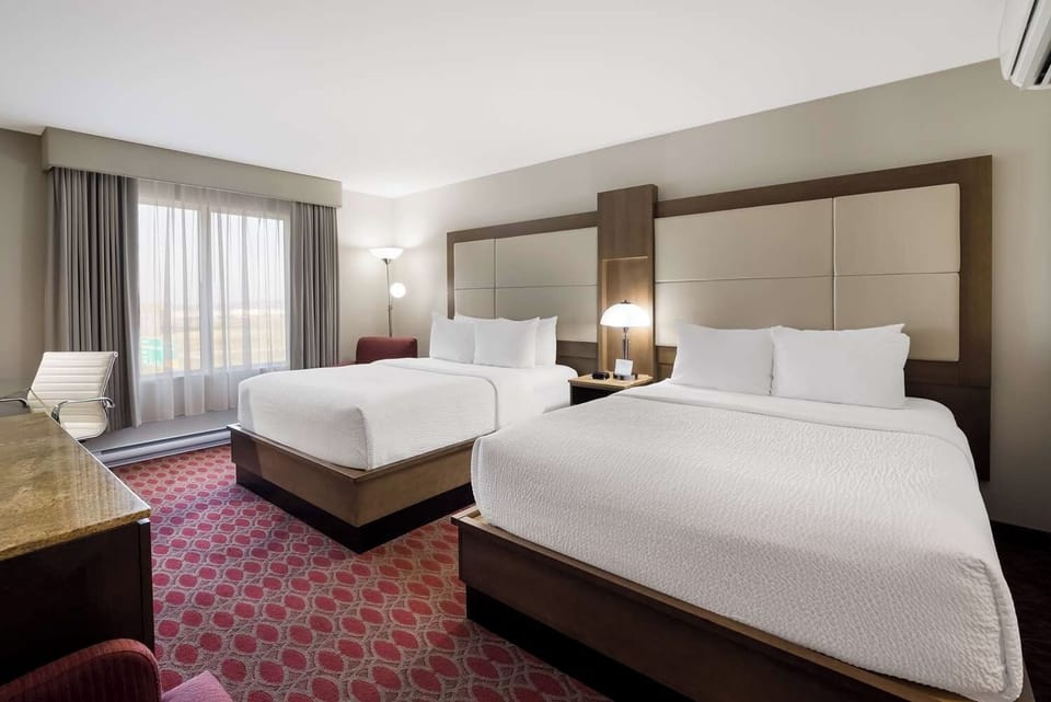 Unwind in crisp, airy comfort with two plush beds.