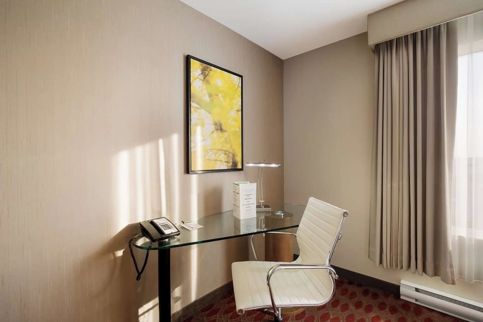 Catch up on emails at a bright, comfortable work desk.