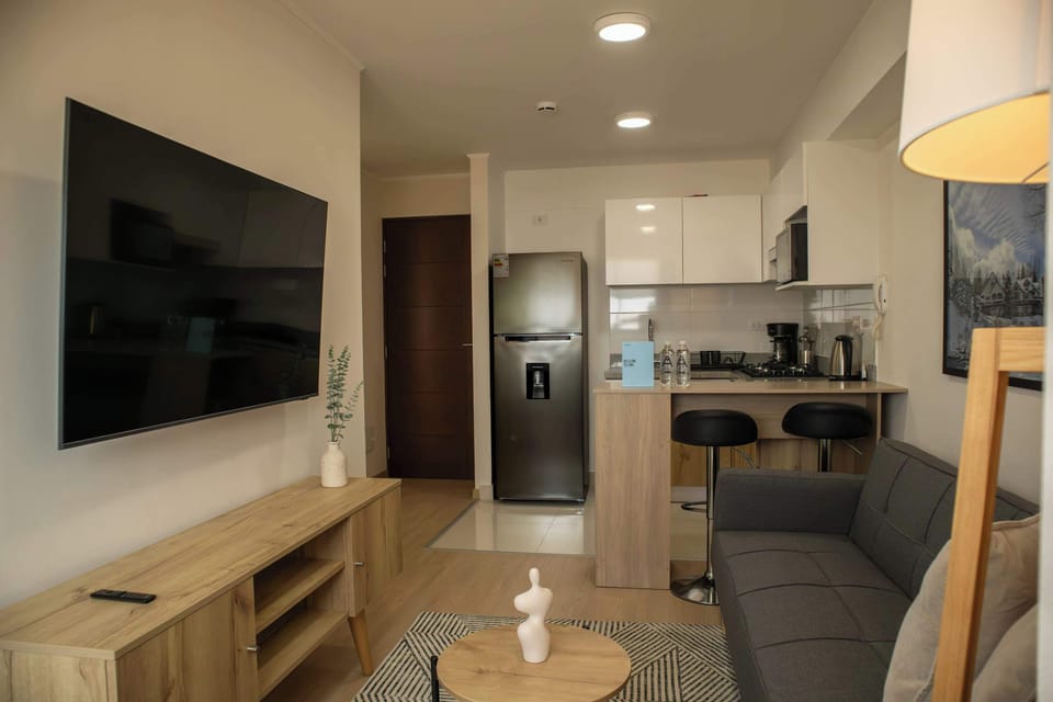 Illuminated lliving room with tv