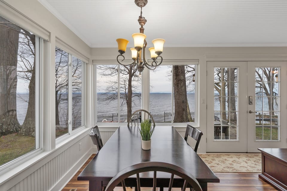 A charming dining area with incredible lake views, perfect for sharing meals or playing games. Let the scenic beauty add to your dining experience.