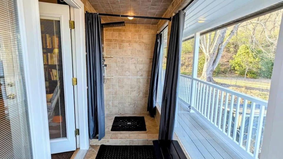 Master "Outdoor" shower!! Feels like you are outside with huge picture windows but it is enclosed for comfort. You can leave curtains open for "outdoor" feel or close them for privacy. Shower has multiple settings including jets and rain shower.