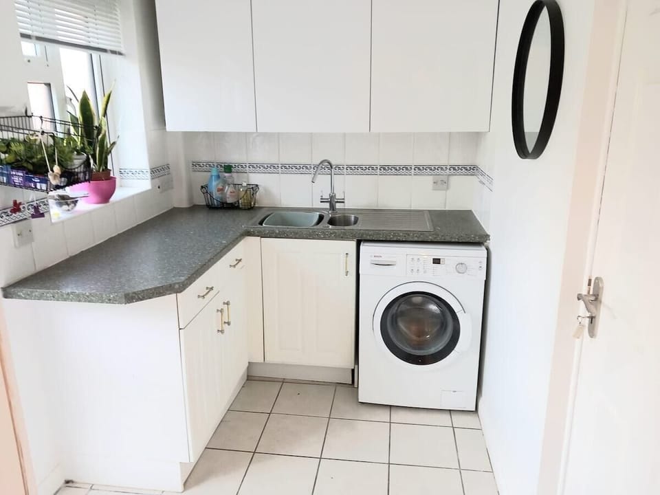 Utility room with washing machine