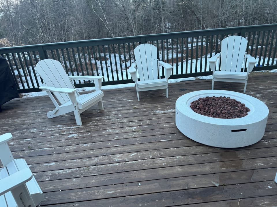 Fire pit and Adirondacks to help you relax. 