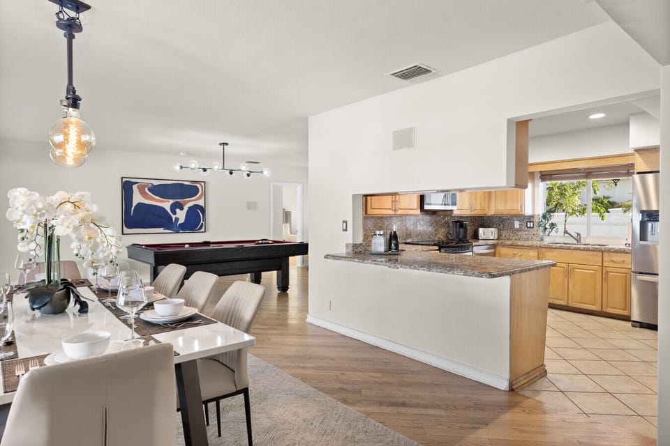 Complete Entertainment Hub featuring Kitchen Living Area and Game Table for Groups