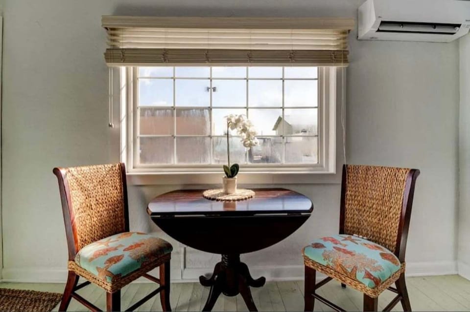 The dining area is bathed in natural light, creating a warm and inviting space to enjoy meals with family and friends.