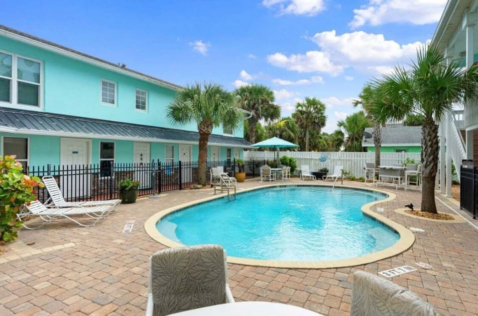 The pool is the perfect spot to unwind after a fun-filled day at the beach or exploring the local area.