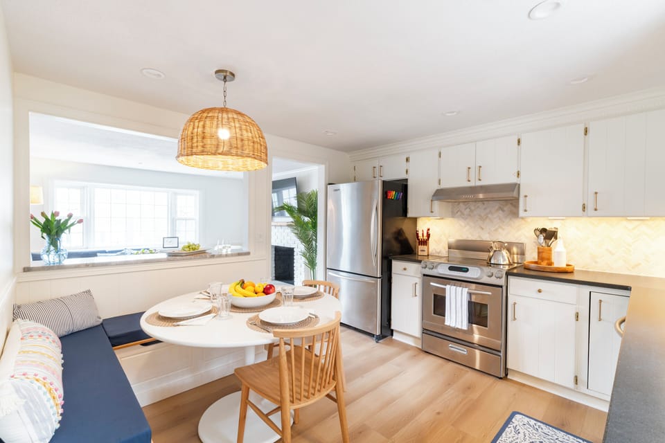 Kitchen with stainless steel appliances opens to the Living Room