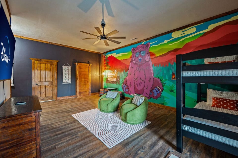 Custom mural bunkroom!! Equipped with an arcade, all kids are sure to enjoy!