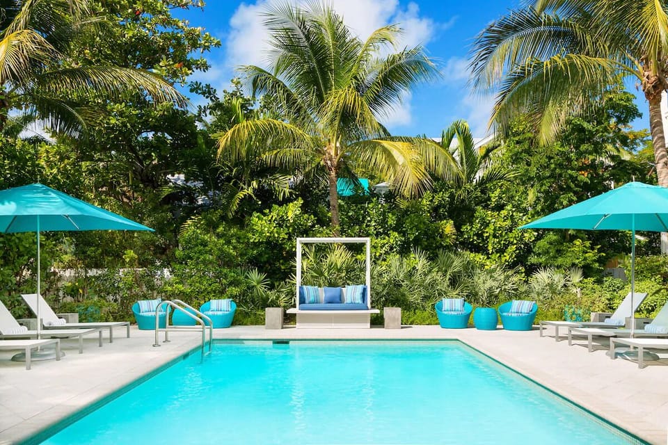 Dive into turquoise calm surrounded by lush tropical greenery.