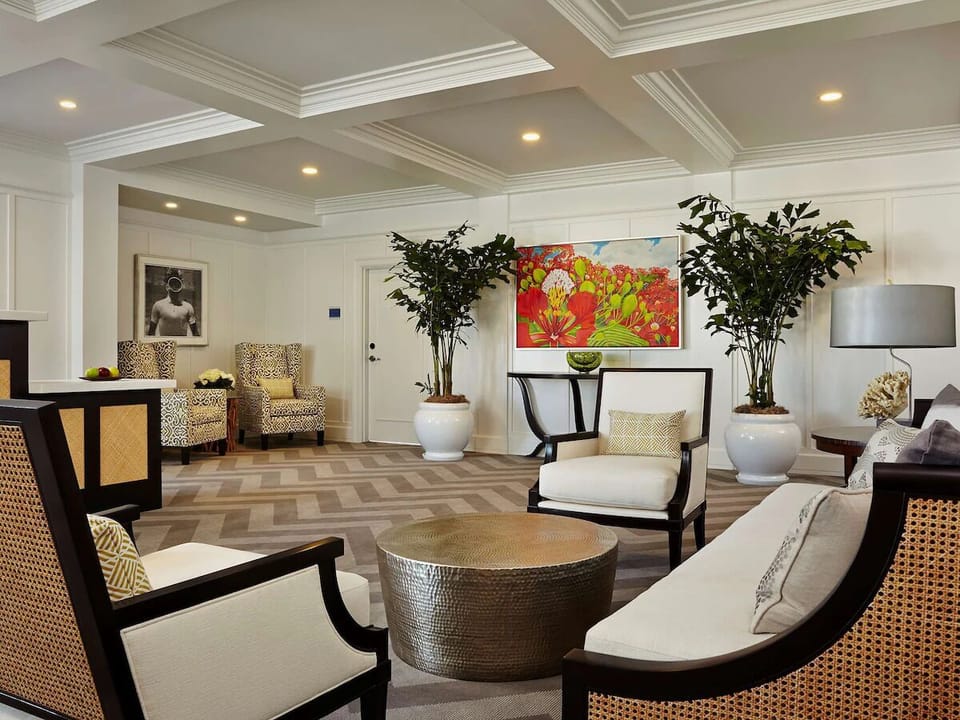 Unwind in a polished lounge with plush seating and artful style.