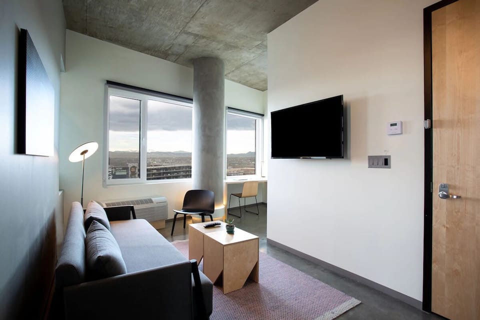 Unwind on the modern sofa after a day exploring.