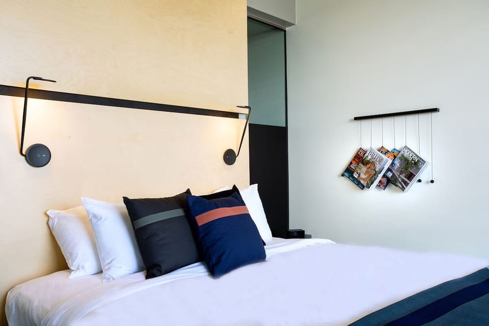 Sink into crisp linens and cozy reading lights for two.