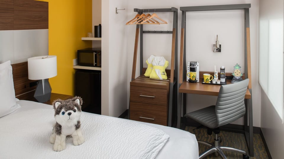 Work comfortably by the window with coffee setup and storage.