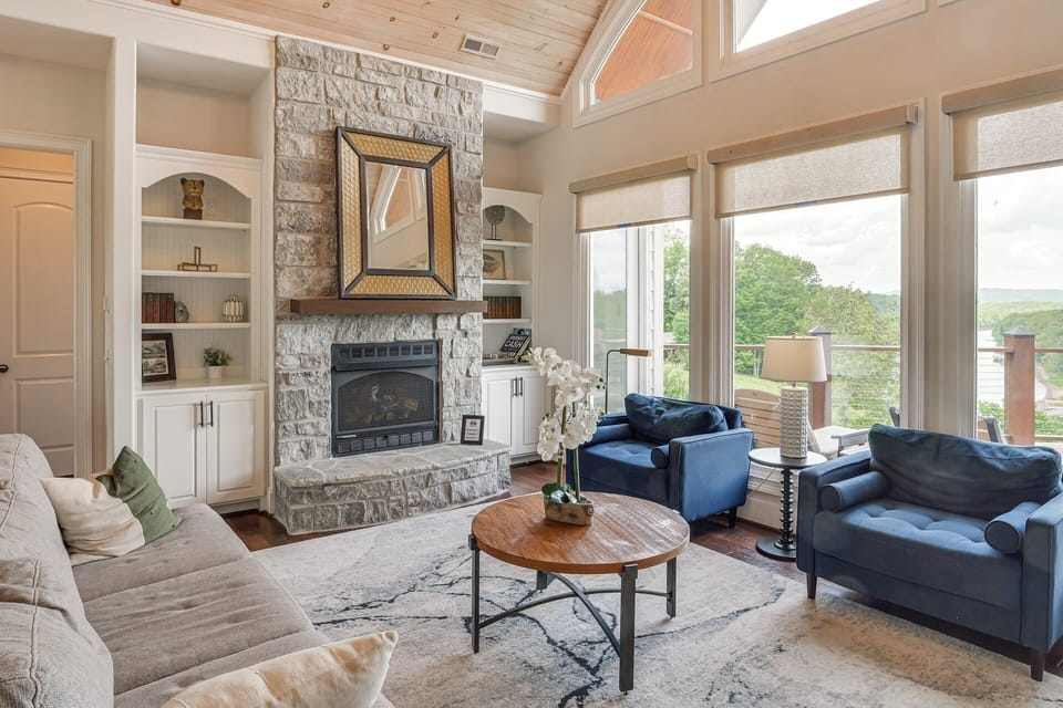 Main family room w/ gas fireplace overlooking the river