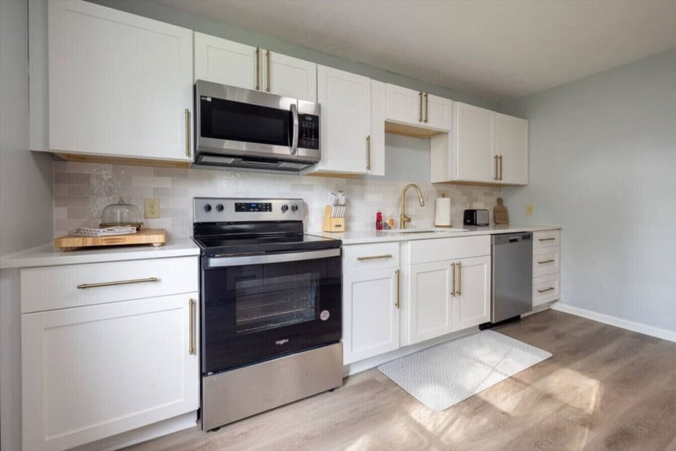 A clean modern kitchen designed for simple everyday comfort with sleek finishes and all the essentials ready for your stay.