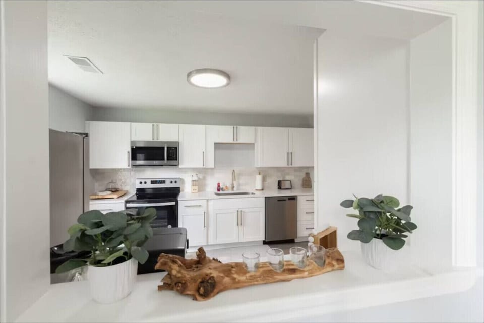 A clean modern kitchen designed for simple everyday comfort with sleek finishes and all the essentials ready for your stay.