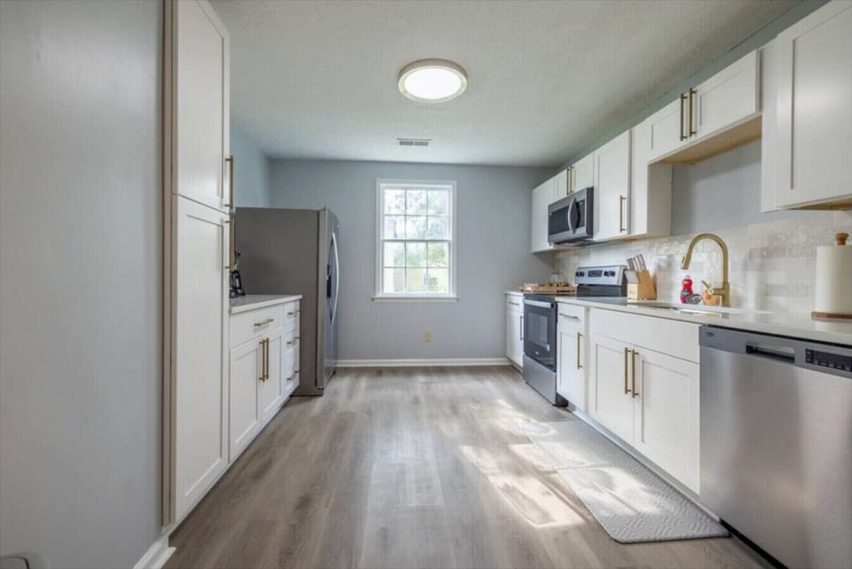 A clean modern kitchen designed for simple everyday comfort with sleek finishes and all the essentials ready for your stay.