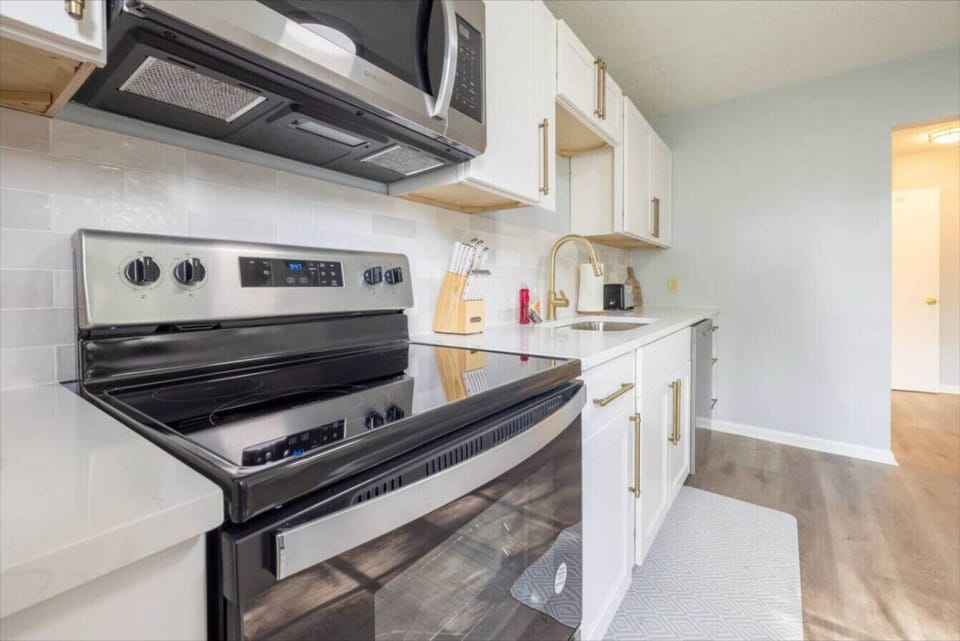 A clean modern kitchen designed for simple everyday comfort with sleek finishes and all the essentials ready for your stay.