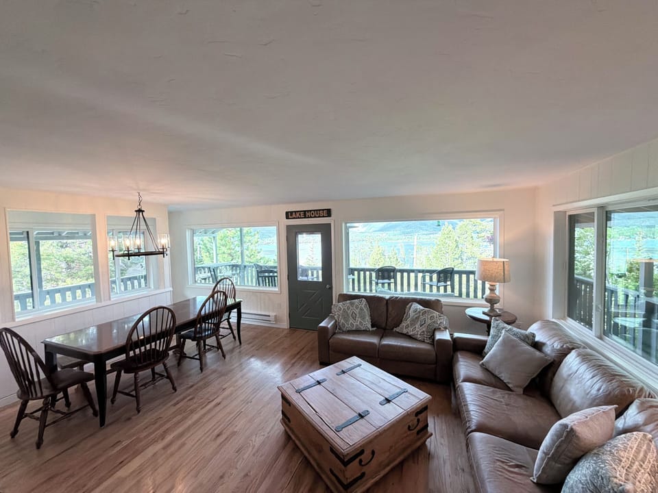 Main floor living room/dining area with 180 degrees of lake & Mountain View’s