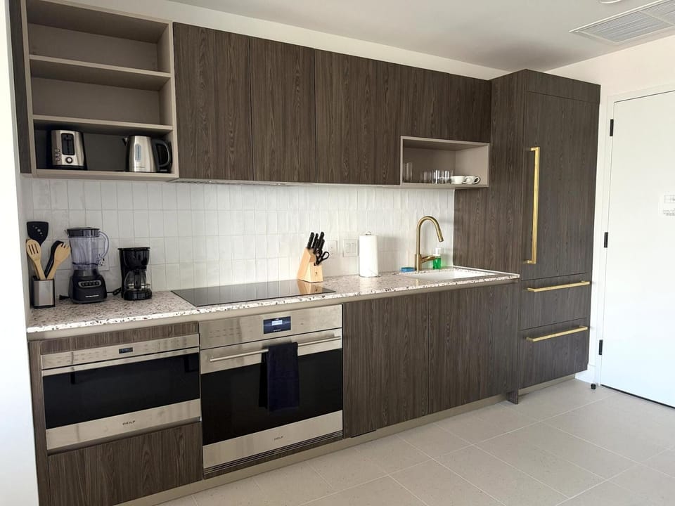 Whip up a delightful meal in your fully-equipped, stylish kitchen.