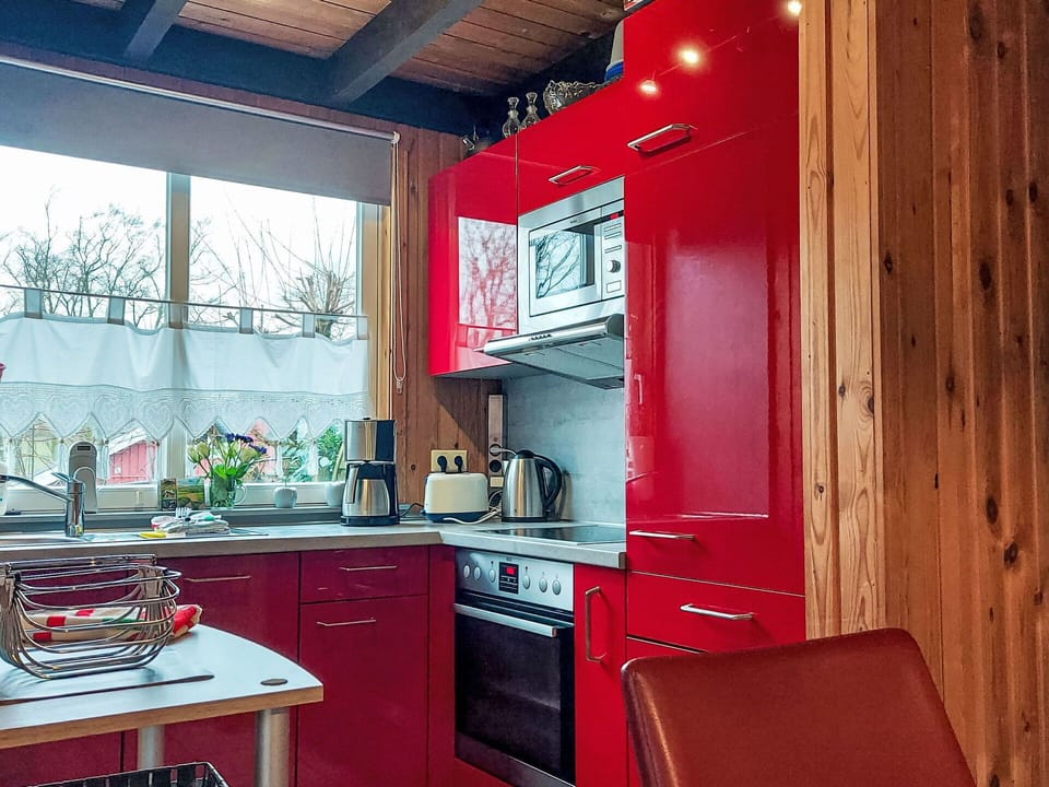 Kitchen, Red, Kitchen Appliance, Countertop, Wood, Interior Design, Furniture, Major Appliance, Cabinetry, Flooring