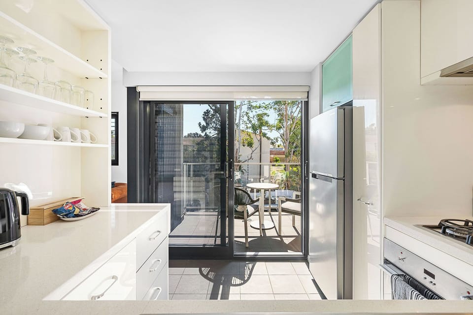 Cook up fun in our modern kitchen, and a sliding doors lead to your balcony space.