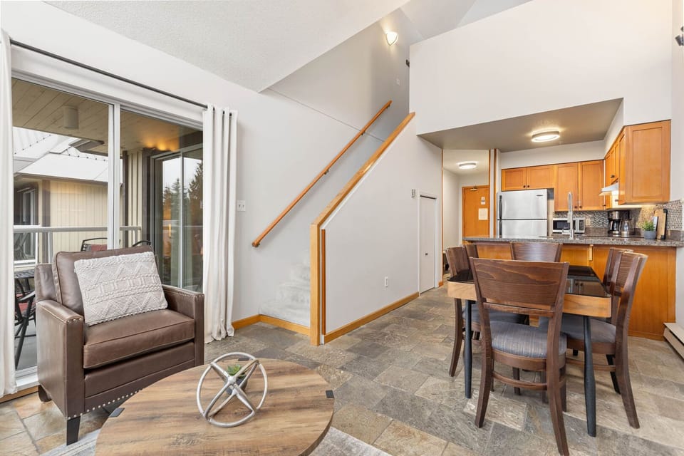 Enjoy seamless access to the private balcony right off the cozy living room