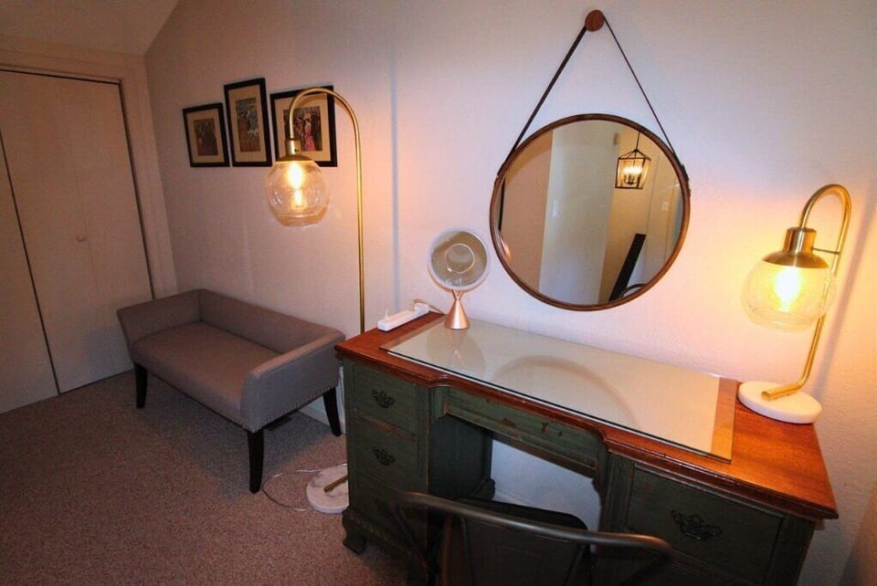 A dedicated workspace and vanity area offers a quiet place to work remotely or get ready for the day.