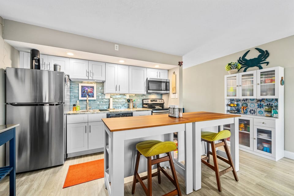 Dining Area and Stainless Steel Kitchen