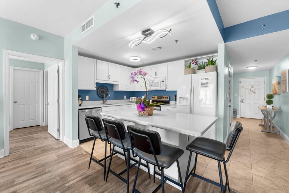 Modern kitchen with a large island and seating for four