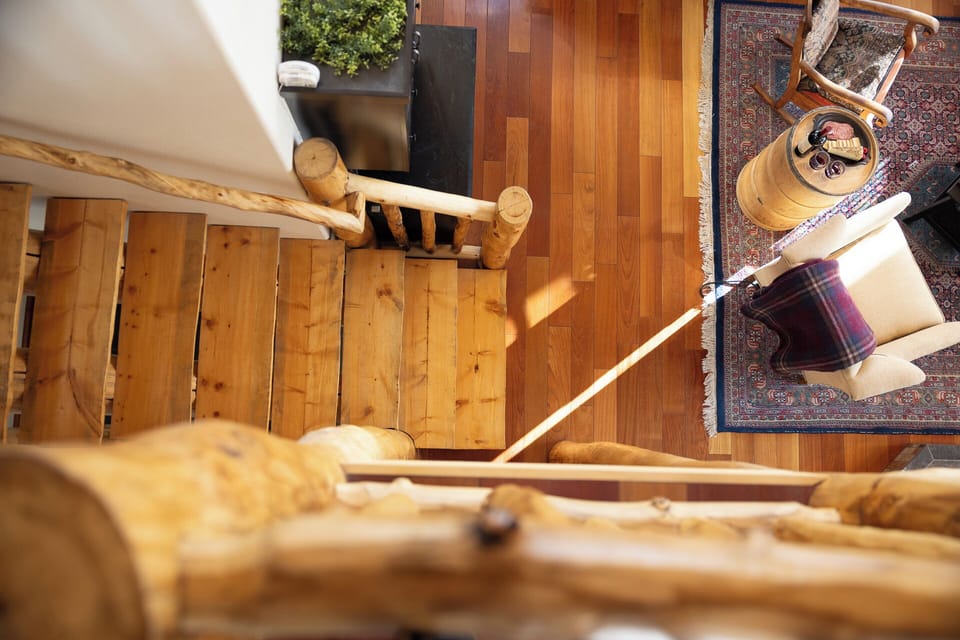 Hand-hewn log railings and natural wood floors — every detail crafted to immerse you in mountain living.