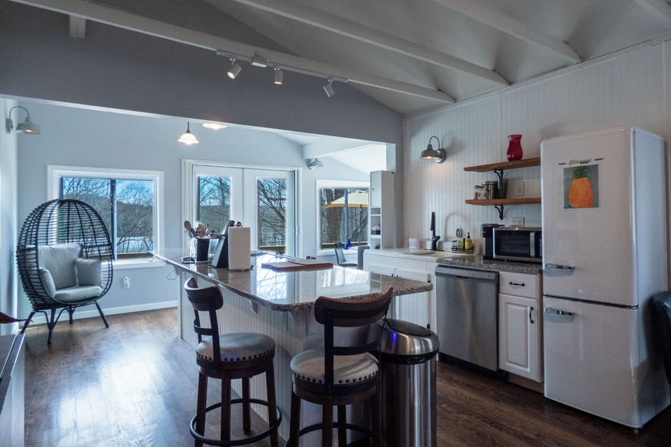 Fully stocked kitchen with sweeping views of the lake