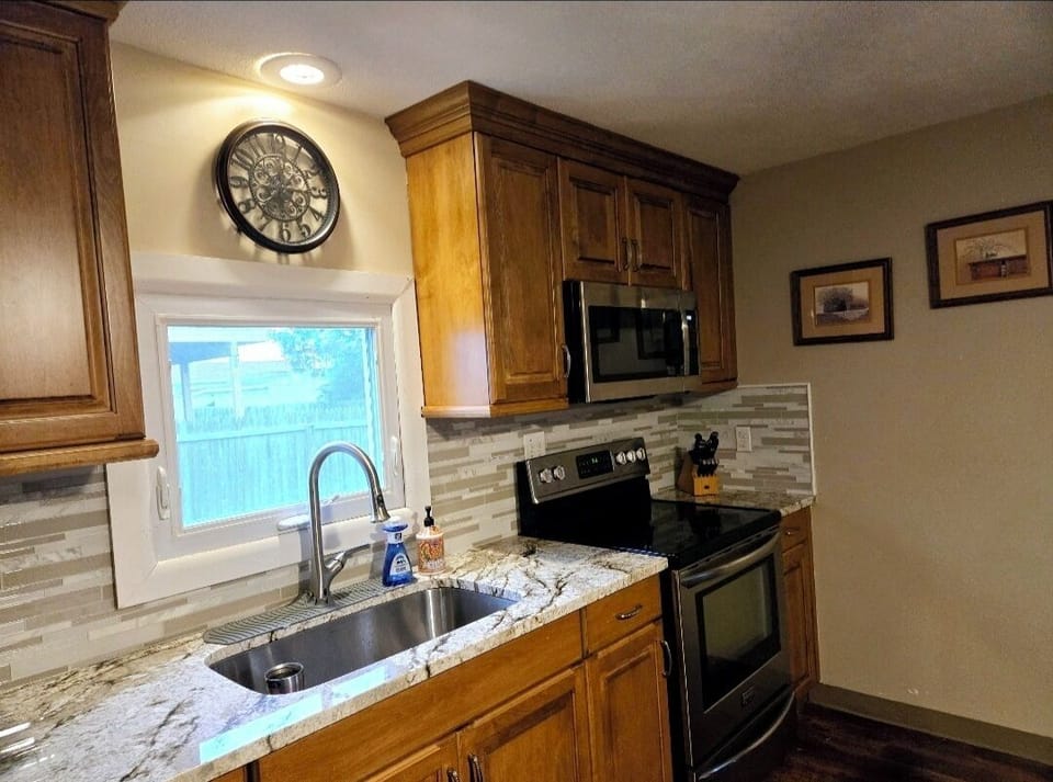 Large sink with newly remodeled fully equipped kitchen