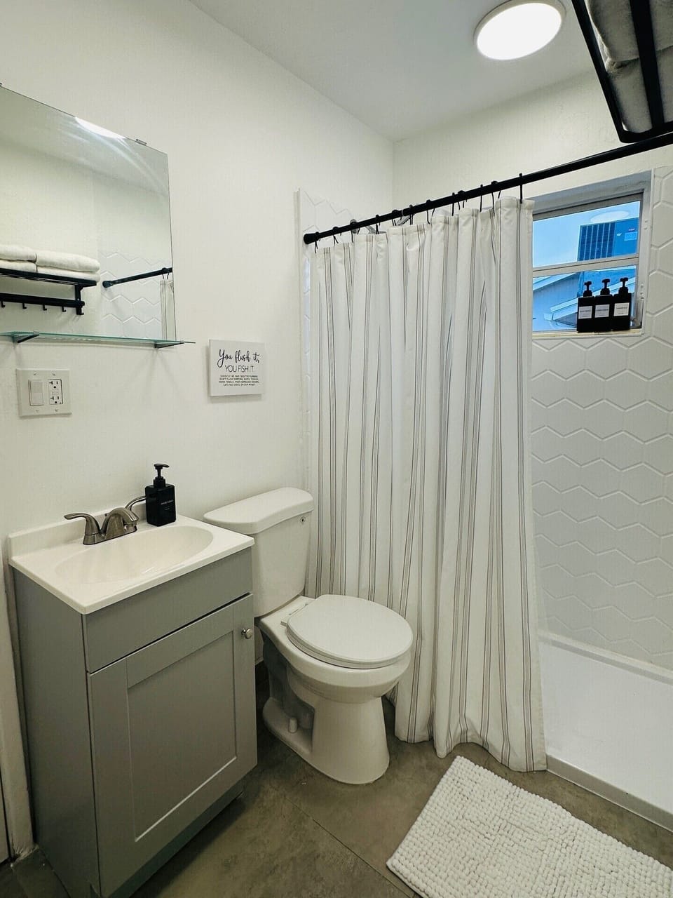 Bathroom with Stand-Up Shower and Toiletries
