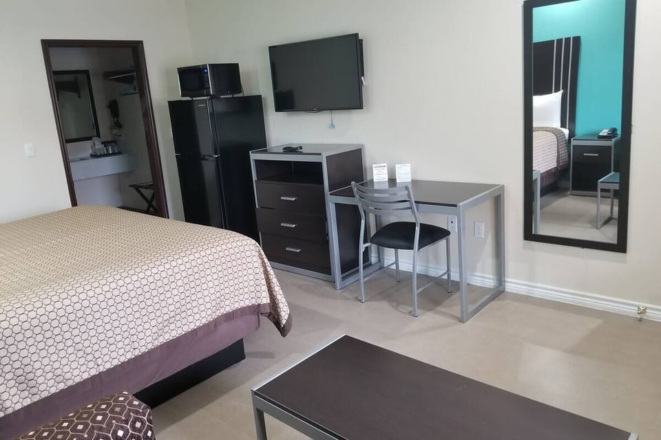 Settle in with a roomy layout, desk, and HDTV.