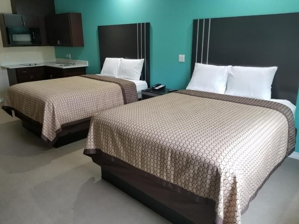 Recharge in a bright double-room designed for restful nights.