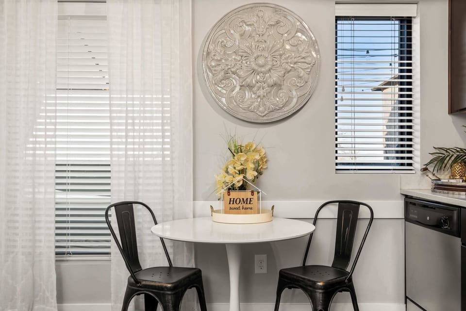Decorative wall accent with woven sunburst mirror