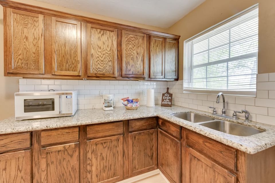 Kitchen with Microwave, Coffee Pot, and Complimentary Snacks